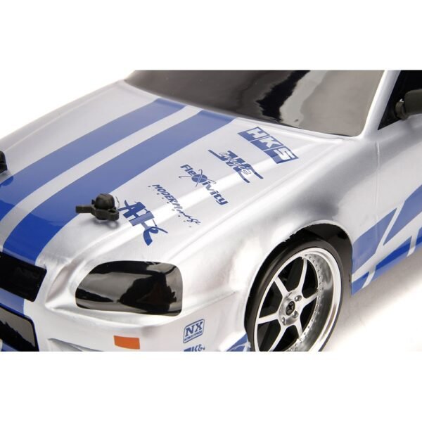 Masina Jada Toys Fast And Furious Nissan Skyline Gtr Drift Cu Anvelope Si Telecomanda - Imagine 12