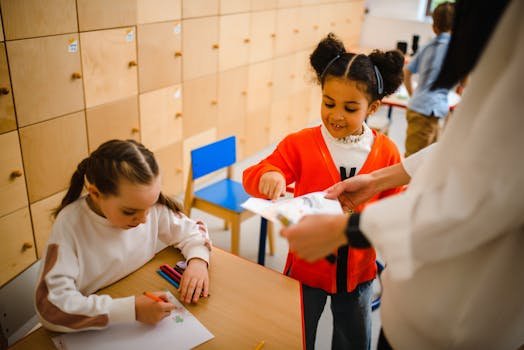 Young children participating in a creative classroom activity with supervision.