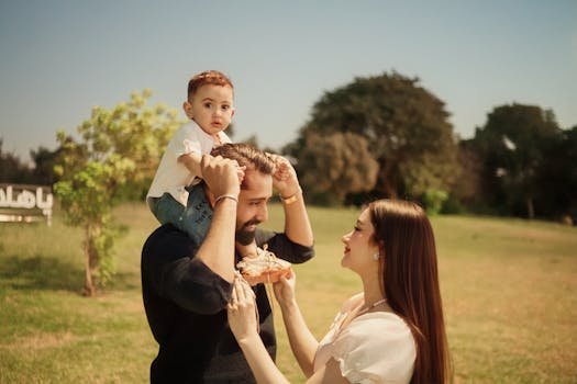 An outdoor family moment with a father, mother, and child enjoying a sunny day in the park.