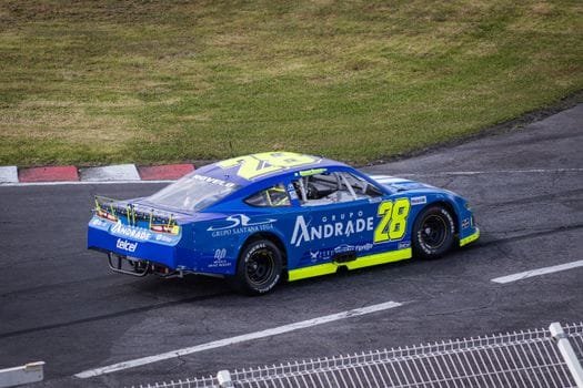Blue race car speeding on a track in Amozoc de Mota, Mexico.